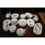 A Royal Worcester herbs pattern 53 piece part dinner and tea service, including 3 tureens, teapot,
