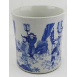 A Chinese blue and white porcelain brush pot, decorated with figures in a landscape scene. H.