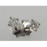 A pair of white metal mounted diamond ear studs, box.