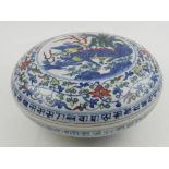 A Chinese Ming style fruit bowl with cover, polychrome decorated with a dragon,