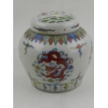 A Chinse porcelain ginger jar, polychrome decorated with dragons amongst stylised clouds. H.