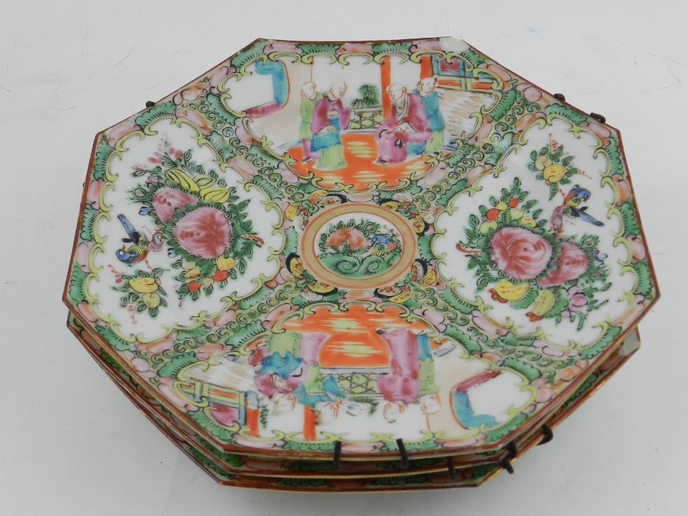 A set of three octagonal Chinese famille rose cabinet plates,