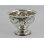 An Irish George III silver stem bowl, repoussé decorated with swags and rosettes,