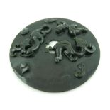 A Chinese spinach green jade plaque, having raised decoration with dragons chasing pearls. D.