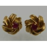 A pair of 9 carat yellow gold and ruby cluster ear studs.