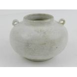 A Chinese Song dynasty twin handled white glazed small jarlet. H.