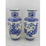 A pair of blue and white Oriental vases. H.