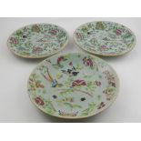 Three Chinese porcelain celadon dishes, decorated with birds, butterflies, flowers and foliage.