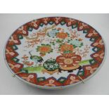 A Chinese porcelain display charger, decorated in the imari pallet with flowers birds and vases,