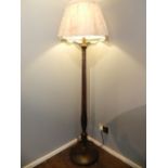 A pair of Regency style mahogany standard lamps, having reeded columns and barley leaf design,