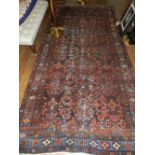 A Persian blue ground runner, having floral design to centre, multi-bordered and fringed, L.305cm,