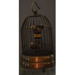 A bird cage clock, with an arrangement of three articulated birds in a domed brass cage, H. 17cm.
