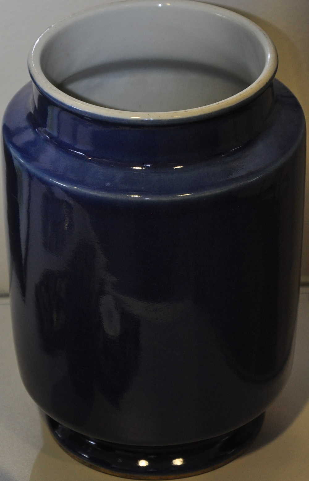 A Chinese blue glaze brush pot, of cylindrical form with a narrow lip and circular base, H 23cm.