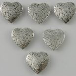 A set of six interesting late Victorian white metal decorative button covers,