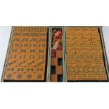 A 20th century mahjong set, the tiles of twin tone tan resin, within a distressed tan leather case.