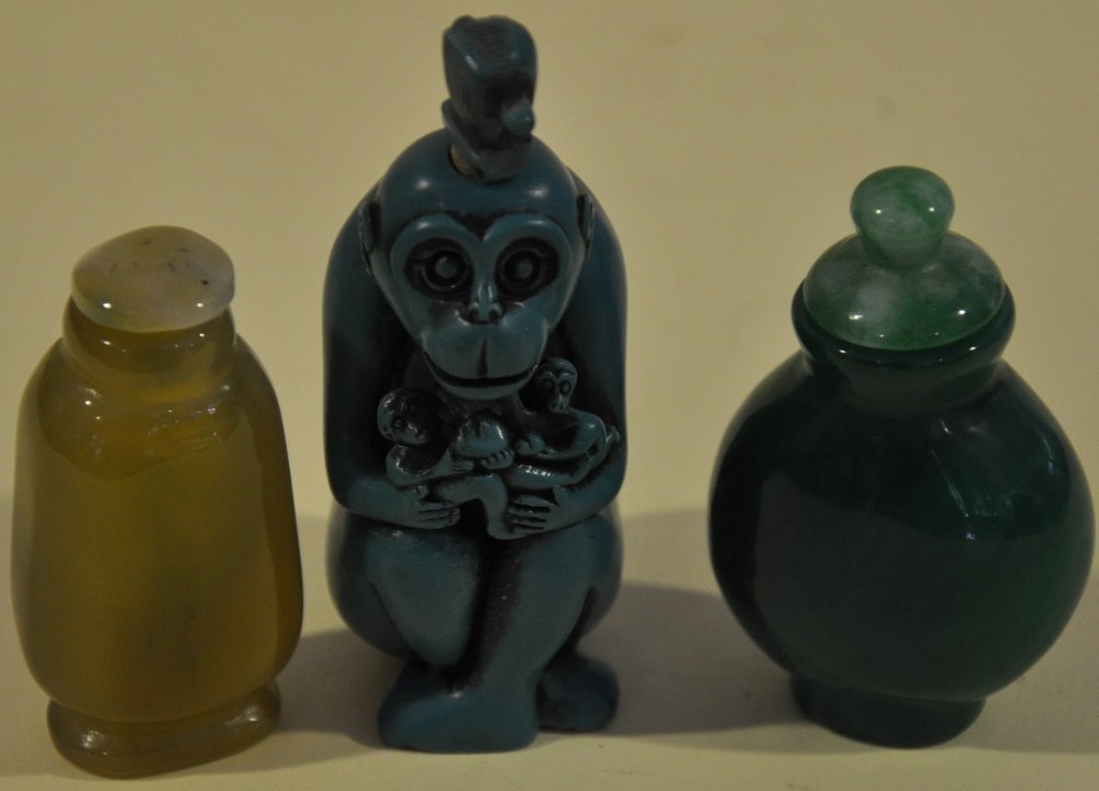 Three assorted Chinese snuff bottles including one carved in the form of a monkey, (3).