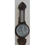 A 20th century barometer, with a carved frame incorporating a thermometer, H. 57cm.