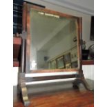 A 19th century rectangular framed mahogany toilet mirror, the plate between turned supports, H.