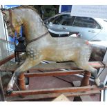 An early 20th century rocking Horse in the manner of Ayres, painted dapple-grey, W. 137.