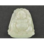 A jade pendant, carved in the form of Buddha, H. 4cm.