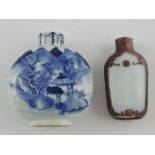 A Peking glass cameo-type snuff bottle, with aubergine and opaque white glass body, lacking stopper,