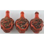 A cinnamon lacquer snuff bottle, the incised decoration of a dragon chasing a flaming pearl, H.