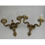 A pair of 20th century gilt metal two branch wall lights.