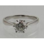 An 18 carat white gold and diamond solitaire ring, the stone over 1.0 carats.
