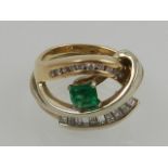 An unusual 14 carat yellow and white gold, diamond, and emerald cocktail ring,