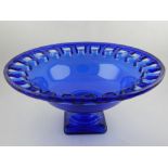 A 20th century decorative glass bowl raised on a square base. Diameter.41cm H.