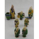 A collection of seven Chinese stoneware figures of scholars, Sancai colours.