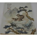 A Chinese rectangular plaque, decorated with squirrels in a mountainous landscape, 37 x 25cm.