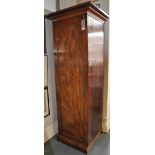 A Victorian mahogany hall cupboard, H. 210 cms (formerly part of a Beaconsfield wardrobe).