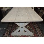 An 18th Century design tavern table, the simulated planked top on faded,