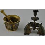 A 19th century continental bronze pestle and mortar cast with shields and armorials, D.
