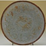 A Chinese celedon glazed bowl with incised floral decoration, D. 17cm.