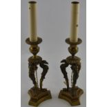 A pair of French Empire style lacquered brass table lamps,