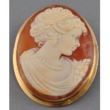 An oval shell cameo brooch, set in yellow metal marked 375, 8.3g.