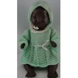 A mid 20th Century British National Doll company black bisque baby doll, with sleeping eyes,