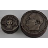 A circular snuff, decorated with Nazi images and the profile of Herman Goring, D.