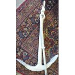A large white painted admiralty type Anchor, H129cm.
