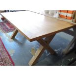A contemporary oak refectory table, with a cleated plank top above X-form supports, L. 180cm.