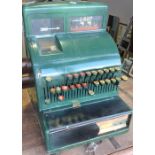 A pre-decimal cash register, now painted green, W. 34cm.