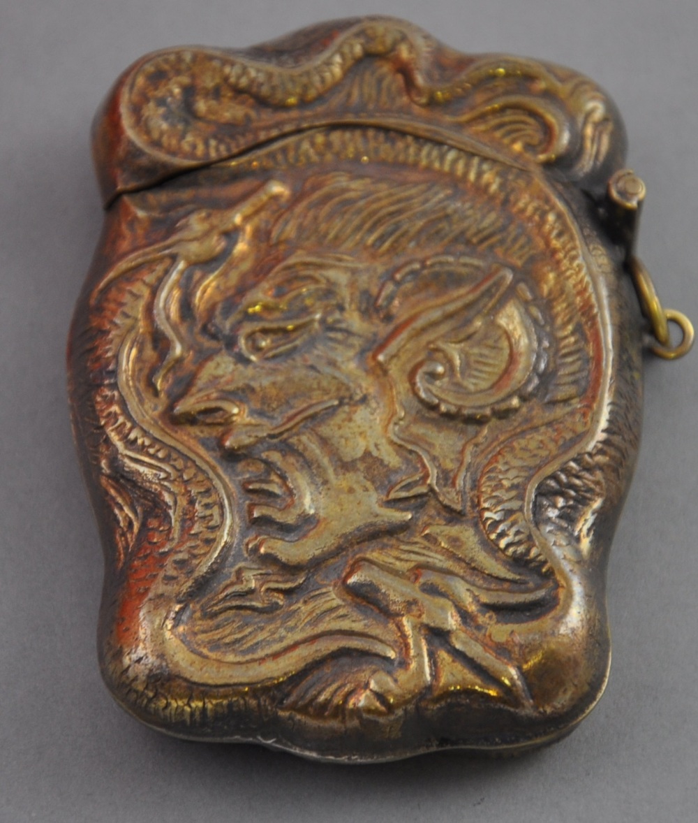 A Victorian style brass vesta embossed with mephistopheles