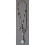 An Art Nouveau style silver and marcasite pendant necklace with faux opal drops