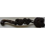 A Chinese carved hardwood rhyi, depicting tree canopies, L. 37cm.