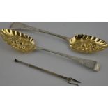 A pair of berry spoons, London 1799, with later repousse decoration and gilded bowls,