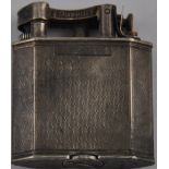 A Dunhill 'Unique' silver cased petrol lighter, London 1936, with engine turned body,