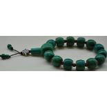 A turquoise and agate bead bracelet incorporating a white metal drop.