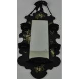 A late Victorian papier mache hanging wall mirror,